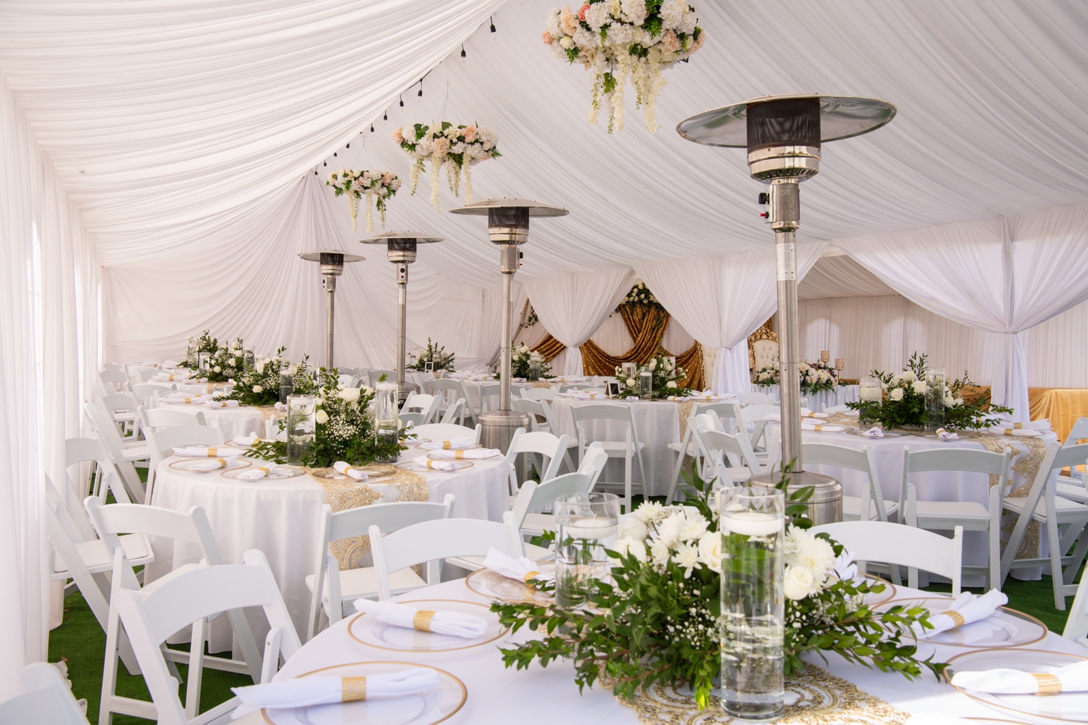 Elegant white tent event setup by Partydise